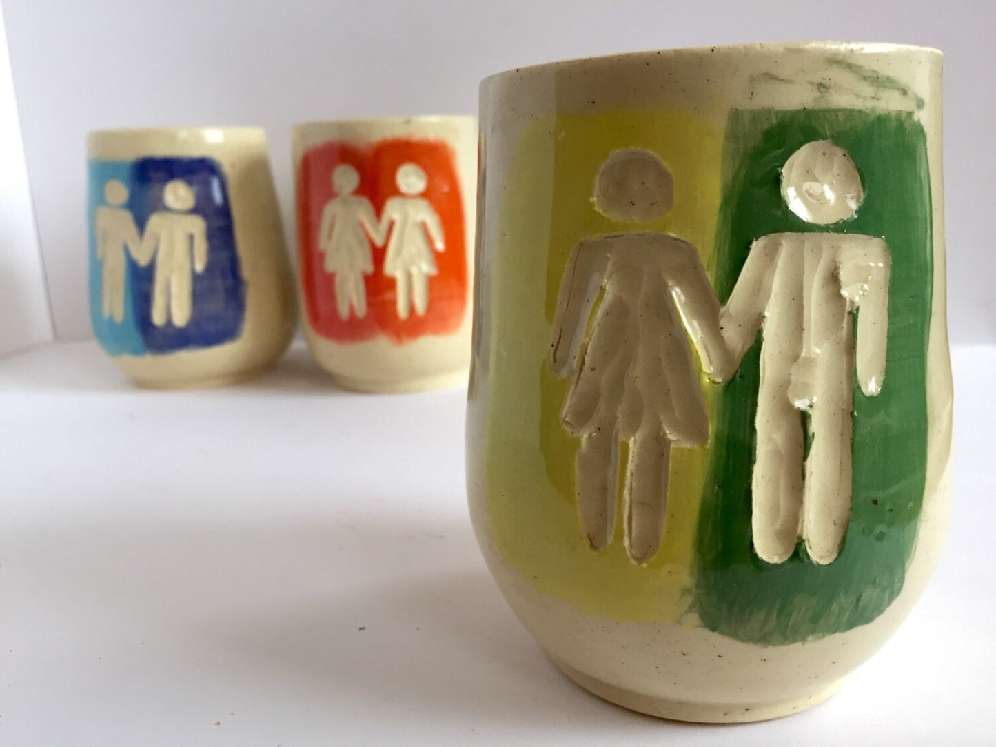 Ceramic tumbler with gay pride inspired design