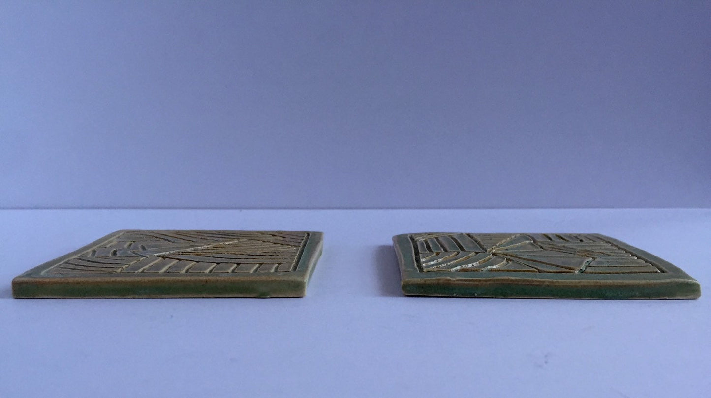 ceramic green coaster set of two with hand carved design