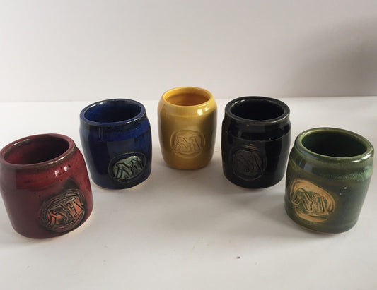 Handmade "magic the gathering" themed ceramic shot glasses with the five basic land