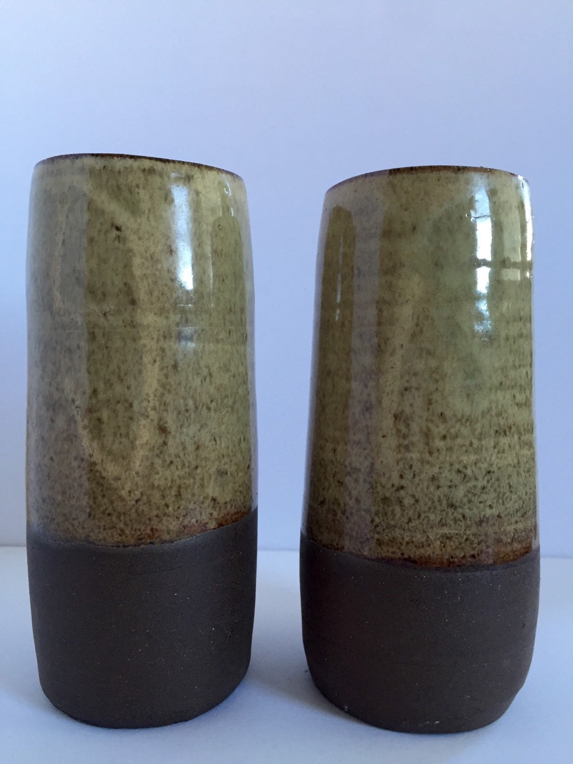 Tall Ceramic vase with sand colored  glaze.