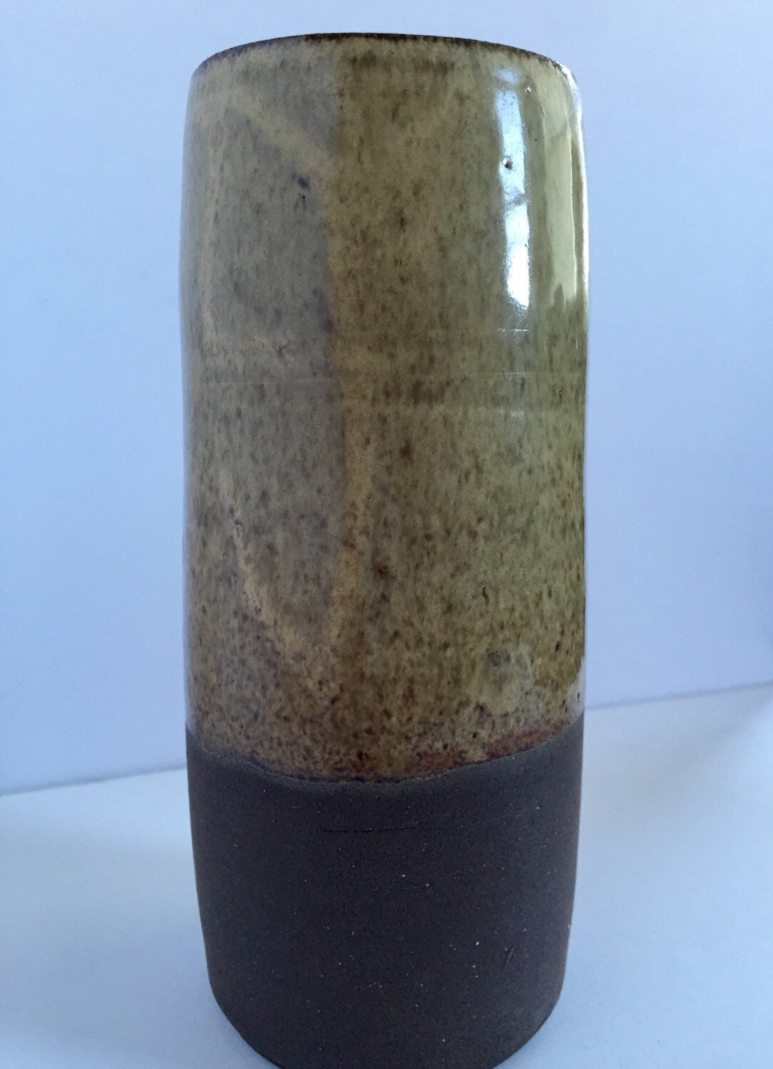 Tall Ceramic vase with sand colored  glaze.