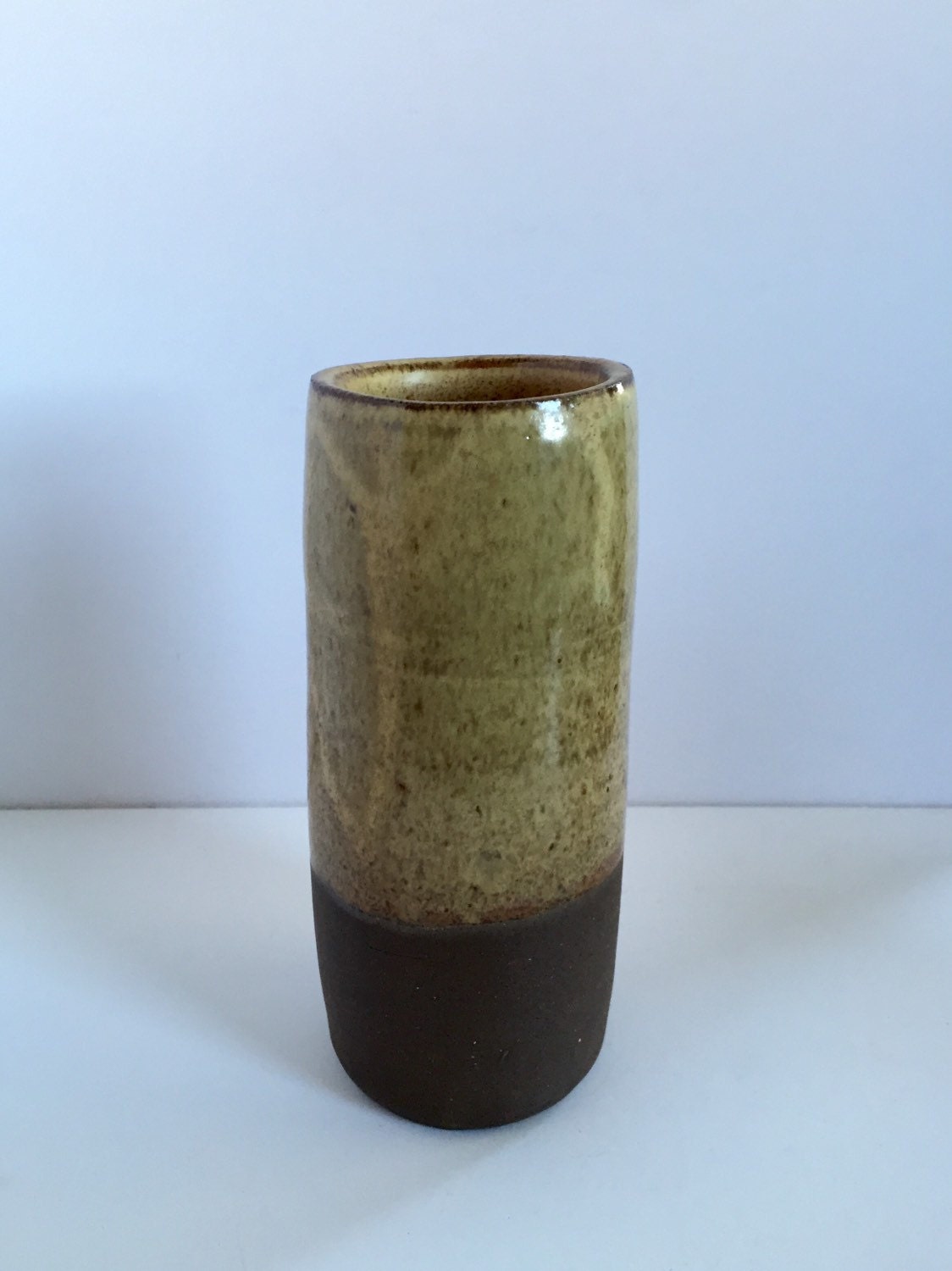 Tall Ceramic vase with sand colored  glaze.