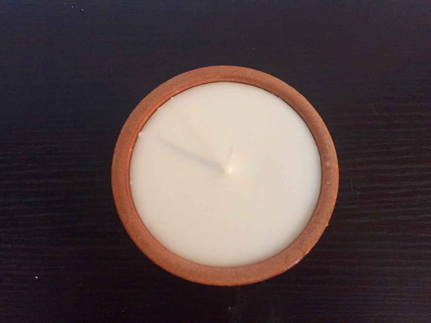 Vanilla scented candles in handmade ceramic jar