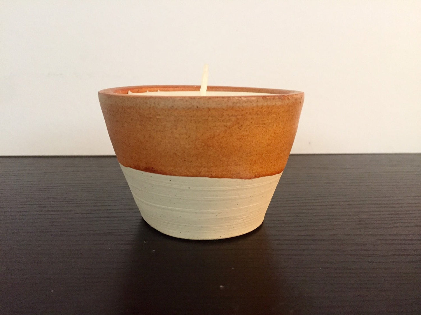 Vanilla scented candles in handmade ceramic jar
